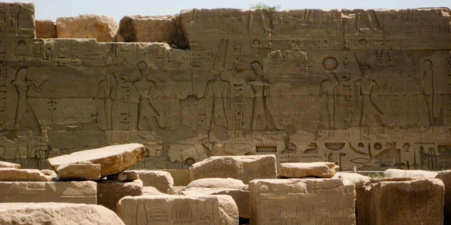 large blocks of stone with hieroglyphic art on them