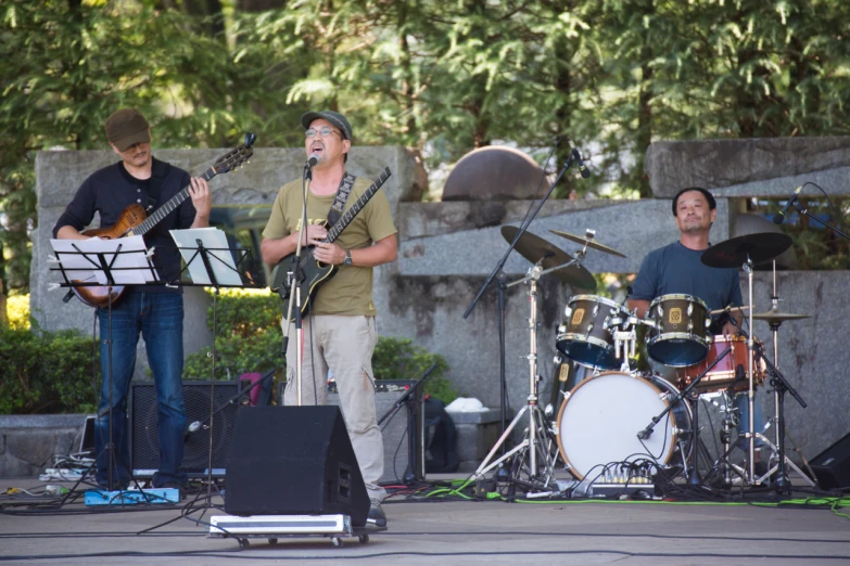 people are performing on stage with instruments