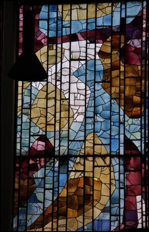 the colorful stained glass window features a cross