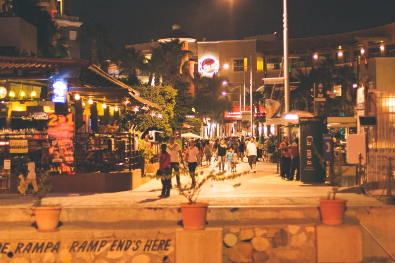 the street is busy and people are walking in front