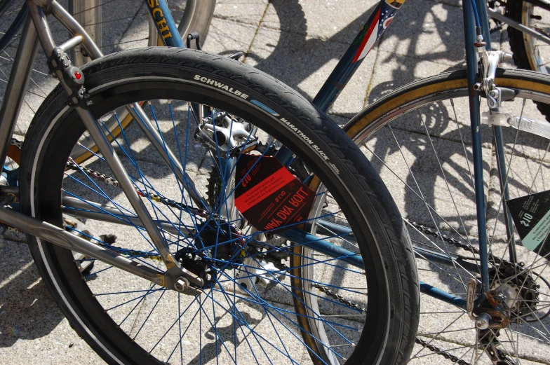 two bikes are parked next to each other with ribbons attached