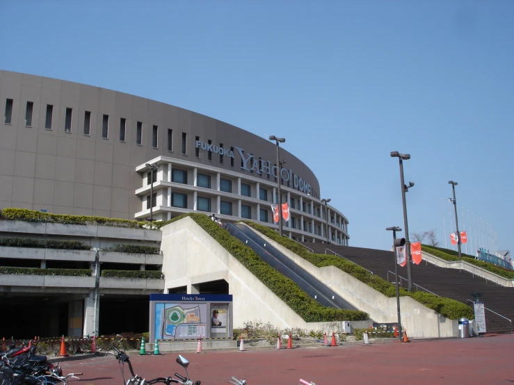 there is a building that has green grass and steps on it