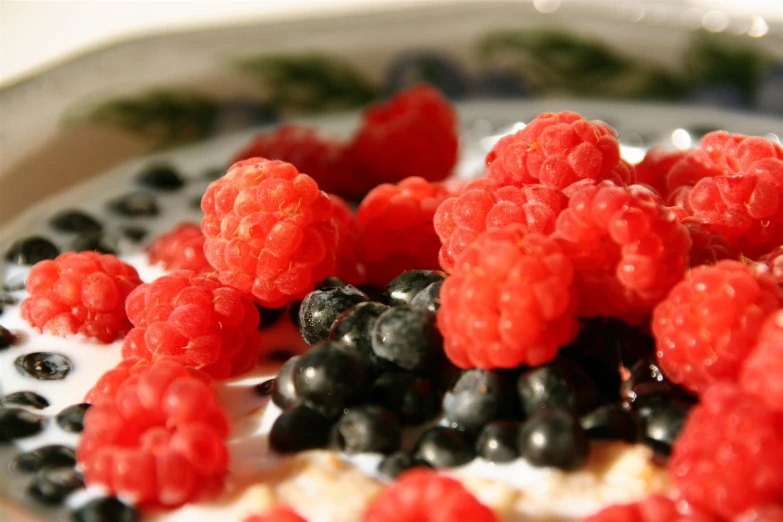 the berries are mixed in with milk and yogurt