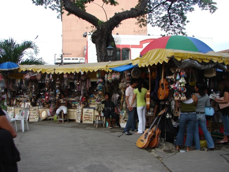 many people are at a music stand and selling items