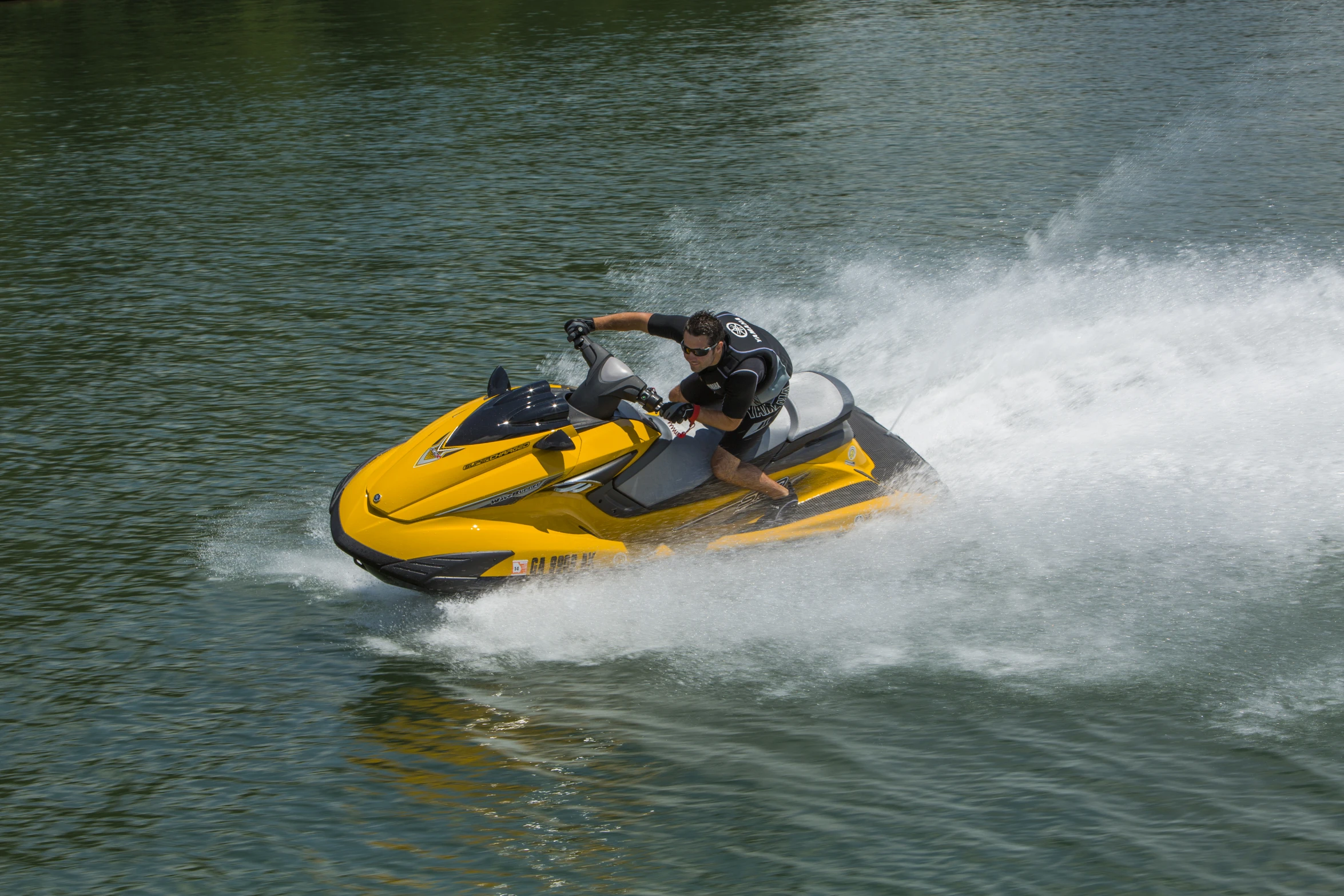 the man is jet skiing in the lake