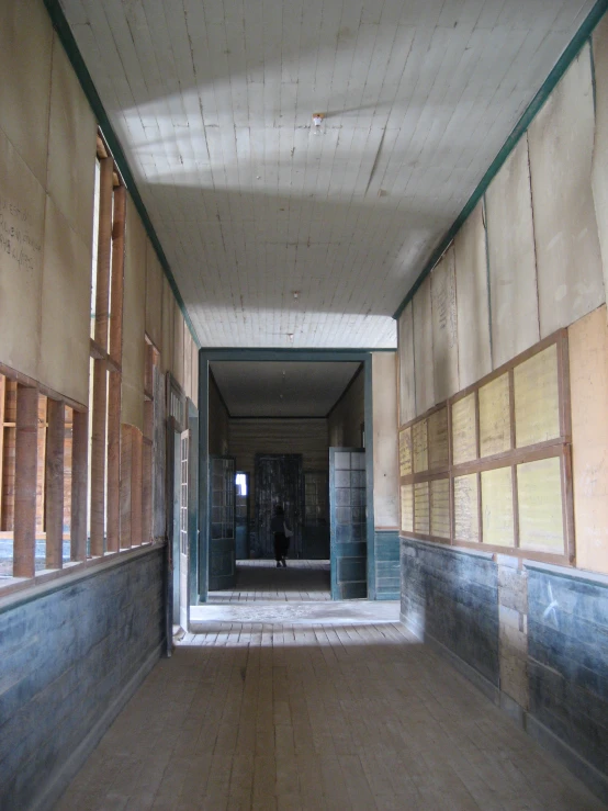 an abandoned building with a long wall in it