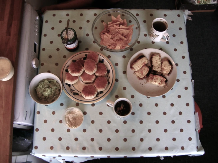 plates of food sit on a polka dot table cloth