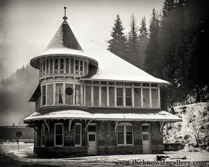 the tower in the snow is made of wood and glass