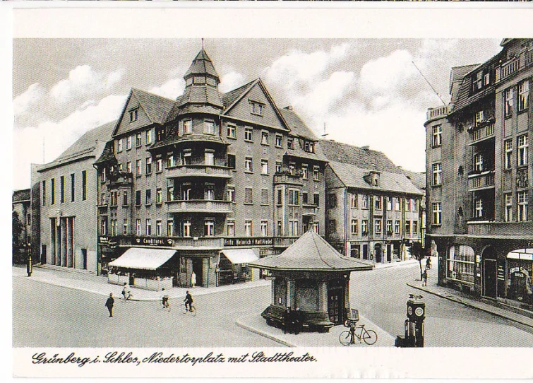 an old black and white po shows people in front of a tall building