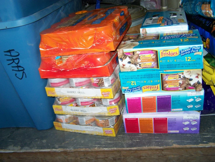 many cat litter bags and containers of different colors