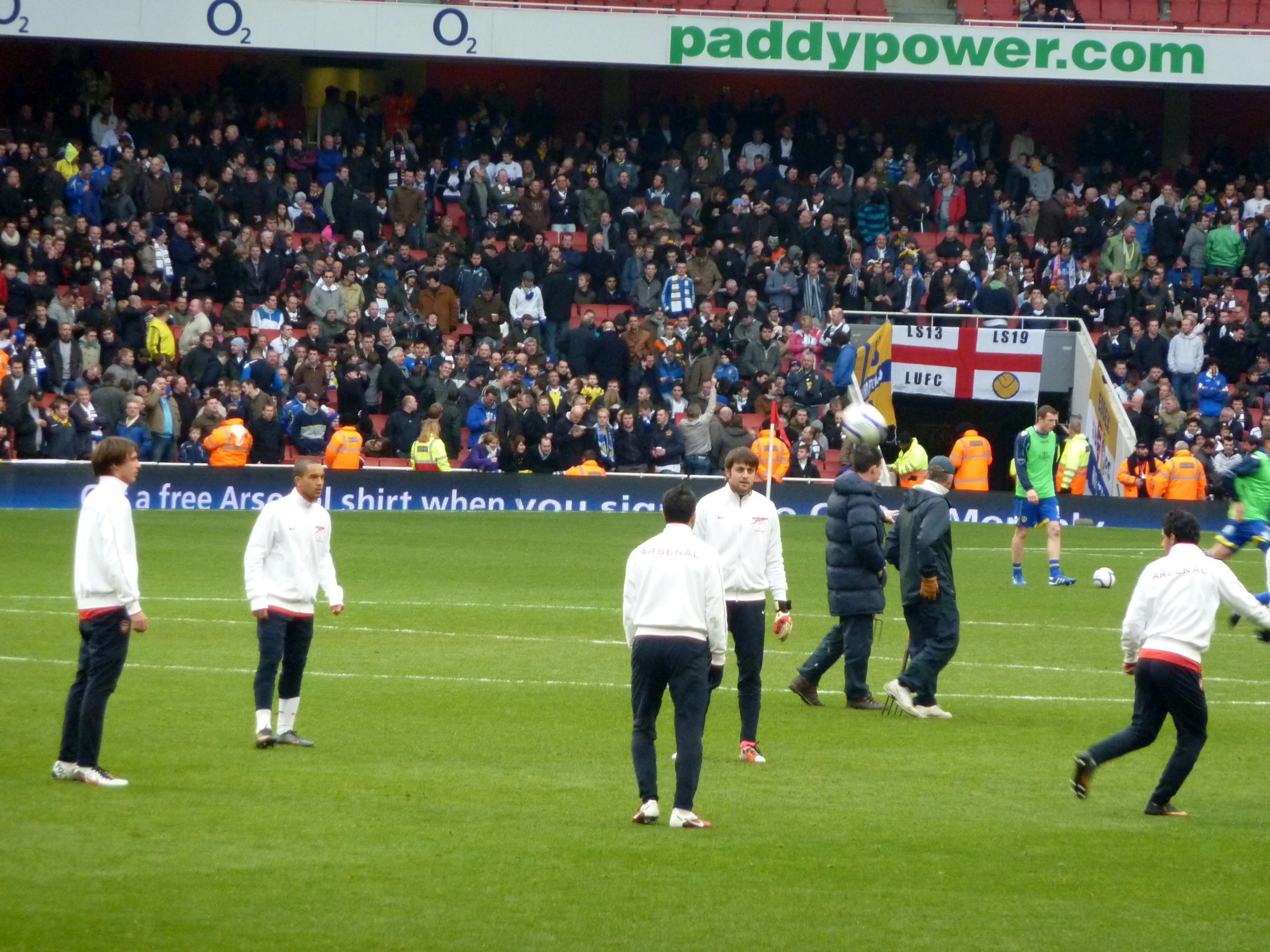 a group of men playing soccer on a field