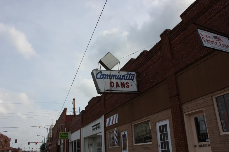 a large sign is above the storefront for community drive