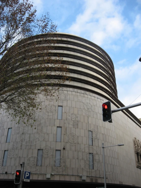 the traffic light is red outside of a building