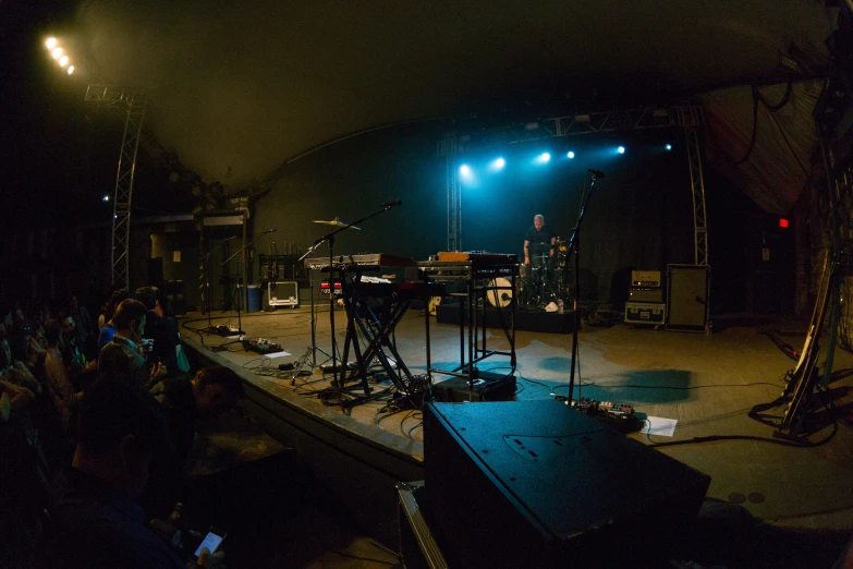 a group of people sitting on top of a stage