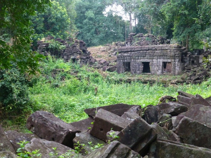 this ruins is surrounded by green vegetation and rocks