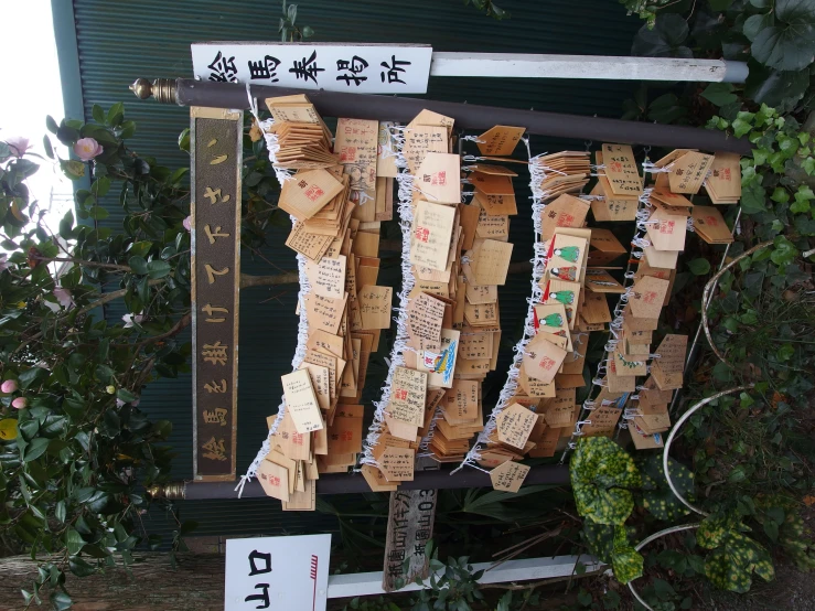 various cards are attached to an asian style pole