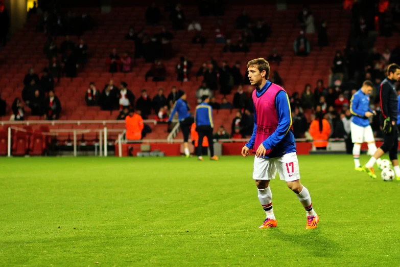 a man stands on the field during a soccer game