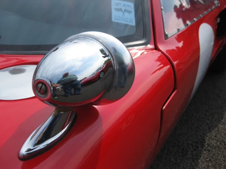 a reflection in a mirror of a car