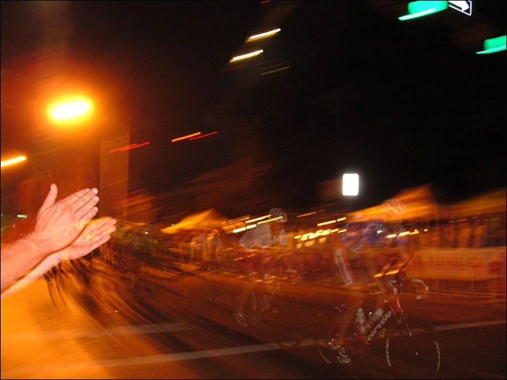 blurry po of a woman in glasses on a bike