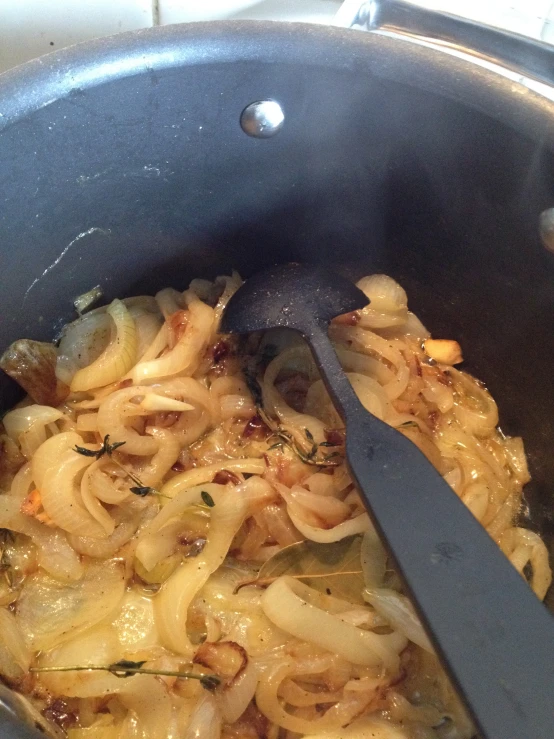 a pot with noodles in it is cooking