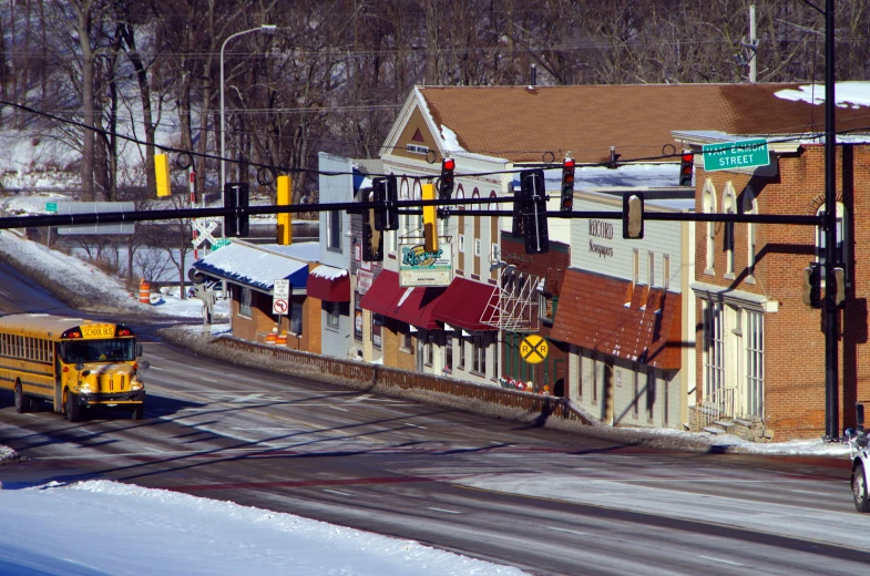 an old school bus moves through town