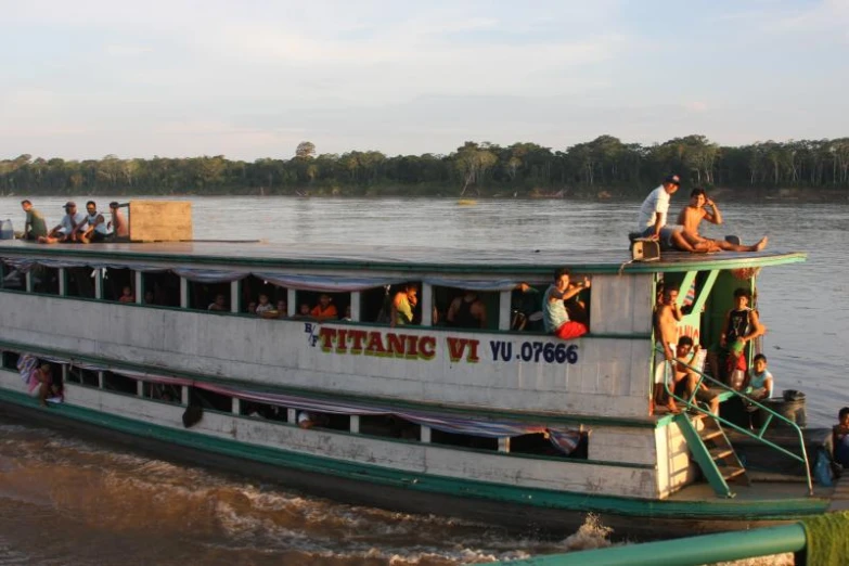 a large boat with people on the deck