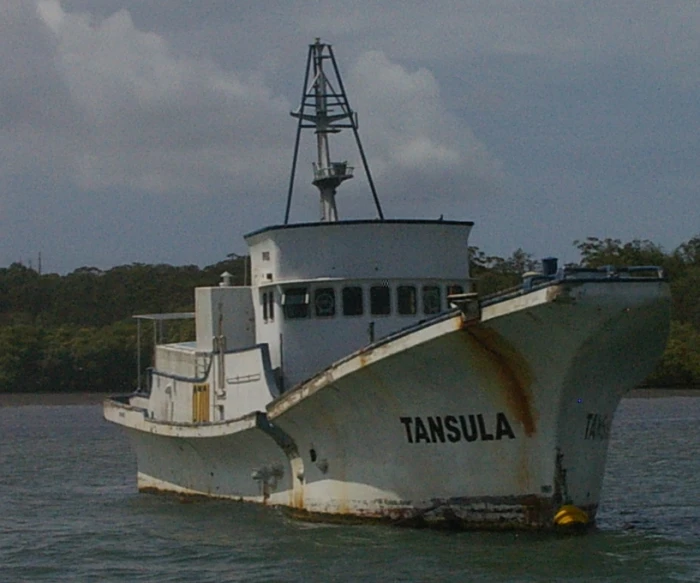 an old and rusty boat with the name tansula on it