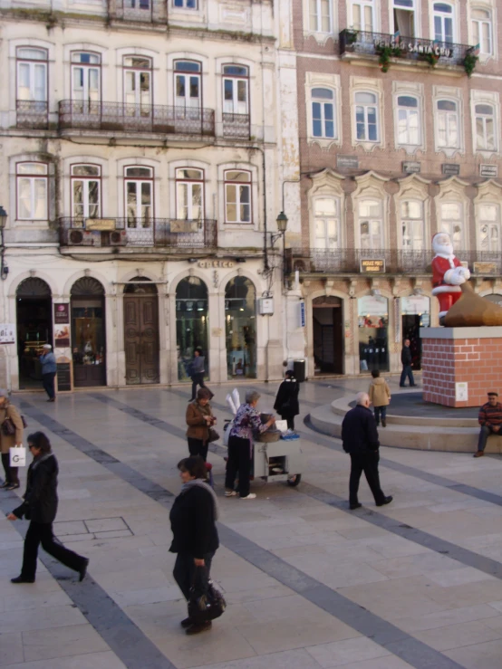 a number of people near one another on their cell phones