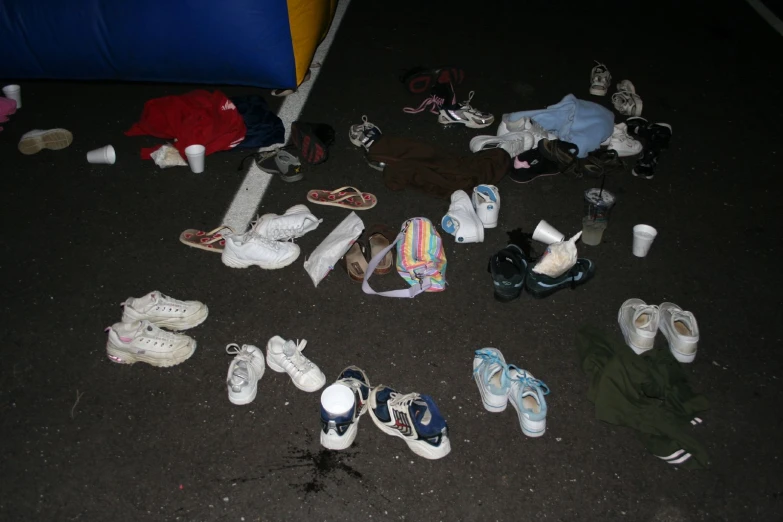 a pile of baby shoes is next to another mess