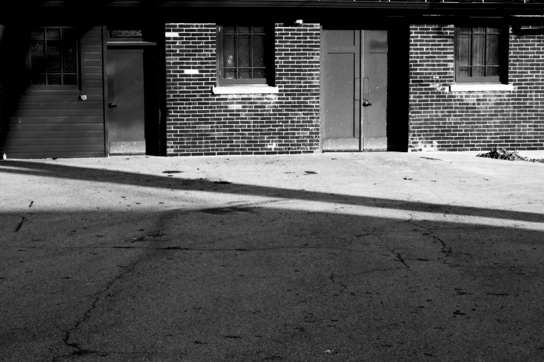 the shadow of a skateboarder skateboards on a walkway