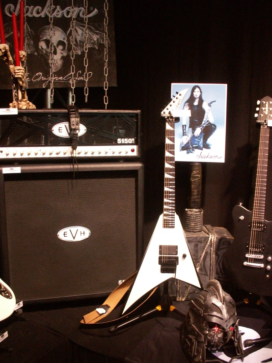 an assortment of guitars and amps are on display