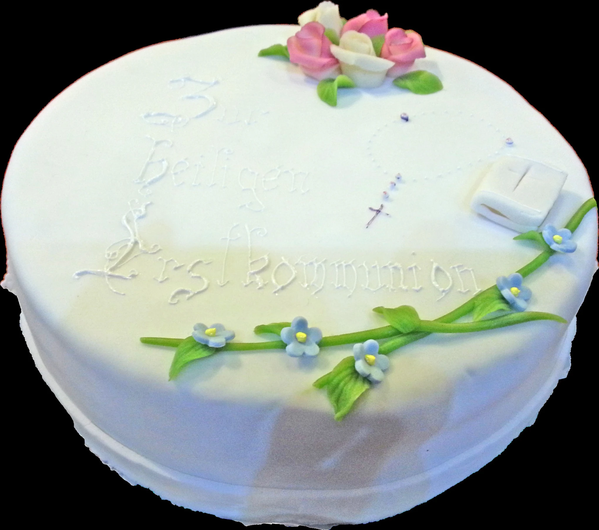 a cake that is decorated with flowers and a book on it