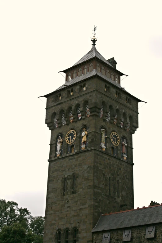 this is an old building with clocks and windows