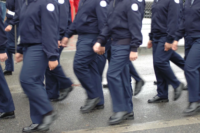 an image of a group of people in uniform that are walking