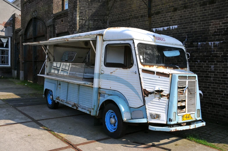 an old truck with soing painted on it