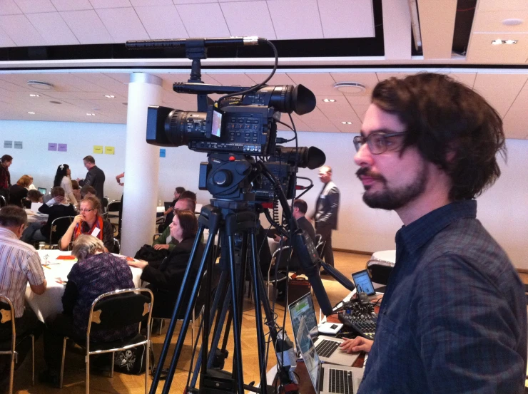 a man standing in front of a camera