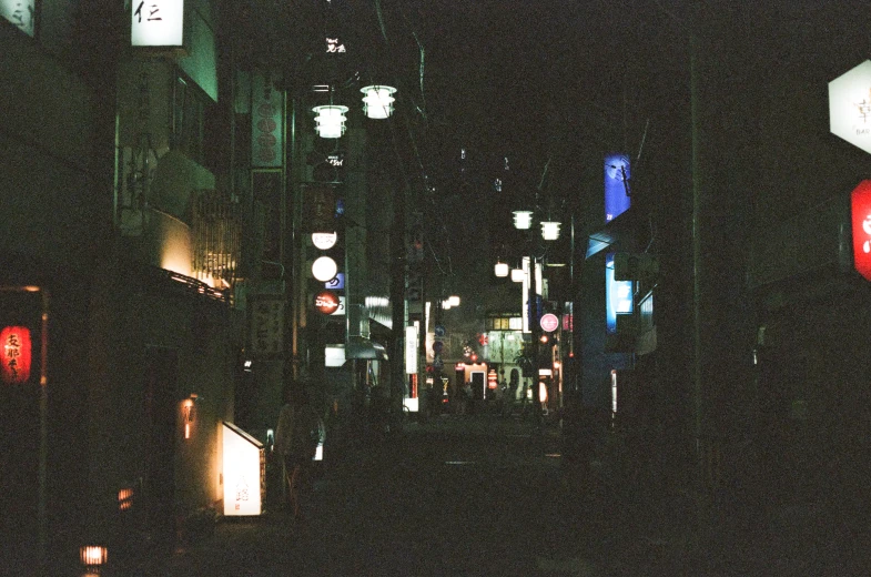 night s of various colored lights on an alley