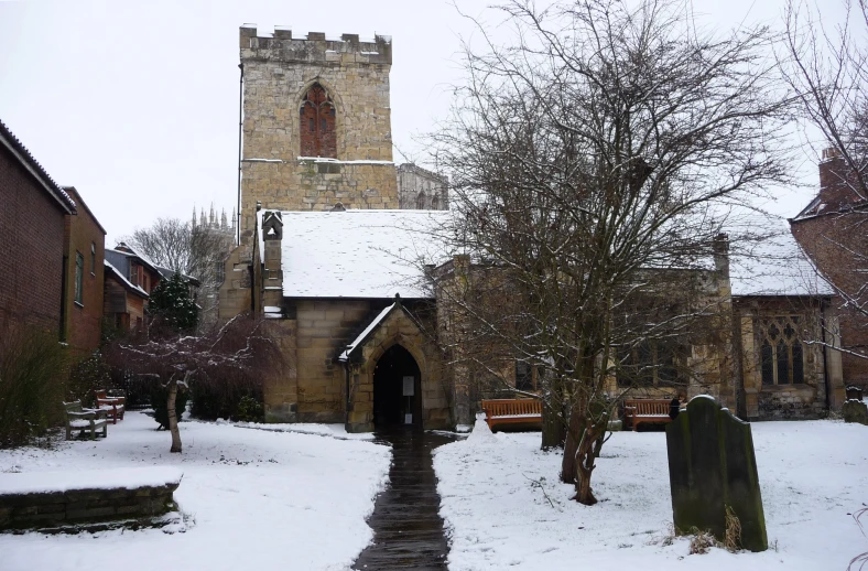 the church is near a grave in the snow