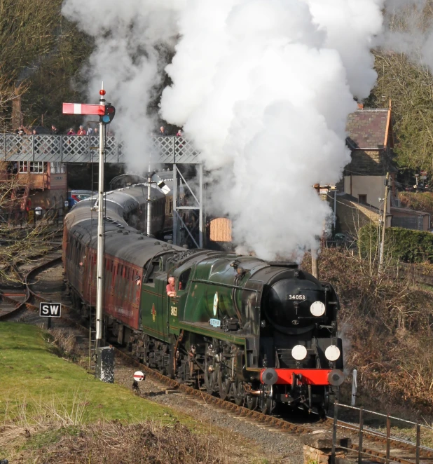 an old fashioned train is traveling through the countryside