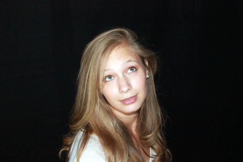 a close up of a person with long hair