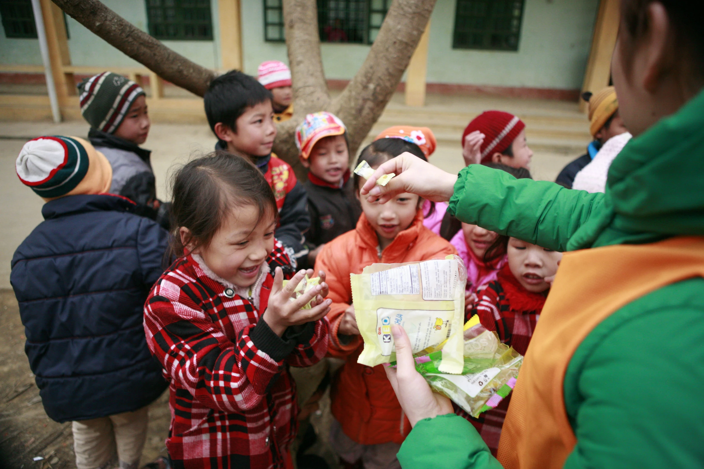 a group of children dressed in red and green