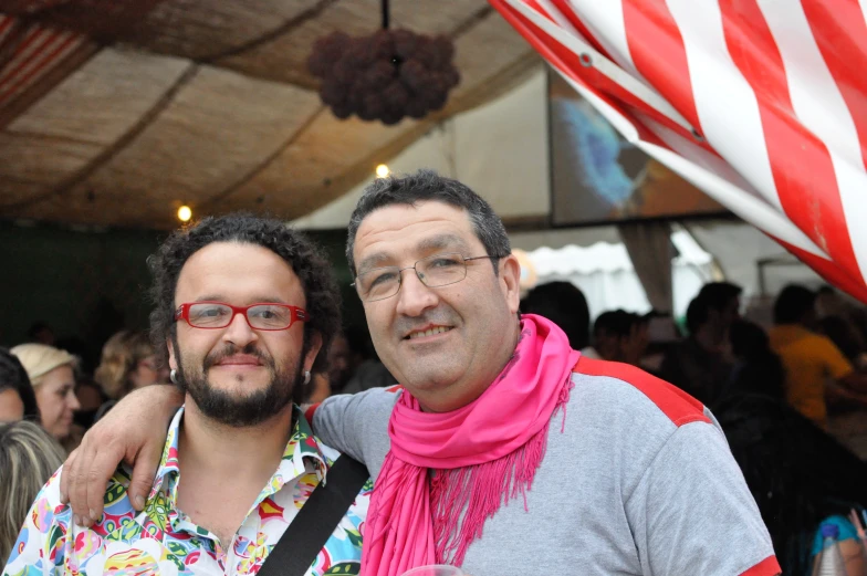 two men are smiling and having fun in the sun