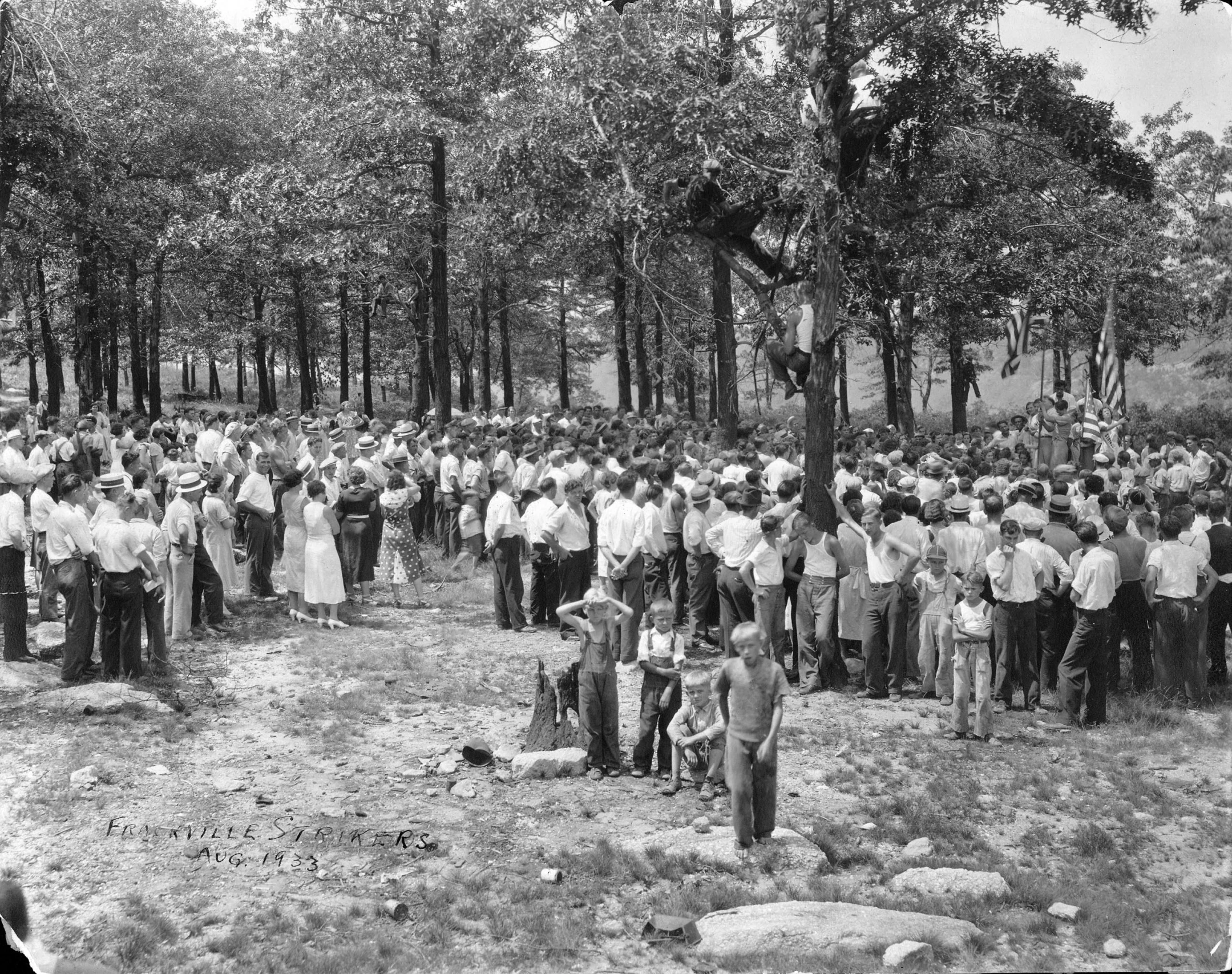 this is an old po of several people in a forest