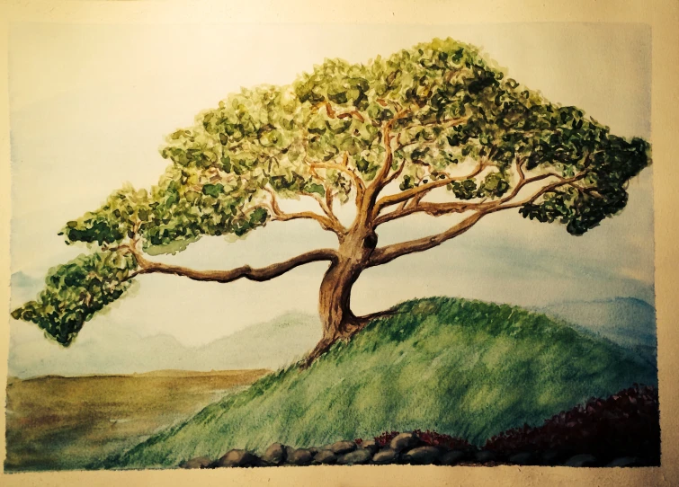 a tree is painted on a green hillside