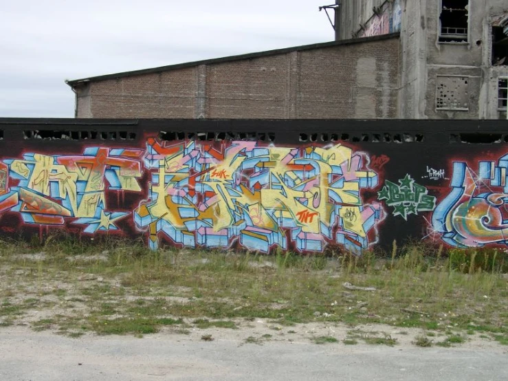 the side of a building is decorated with graffiti