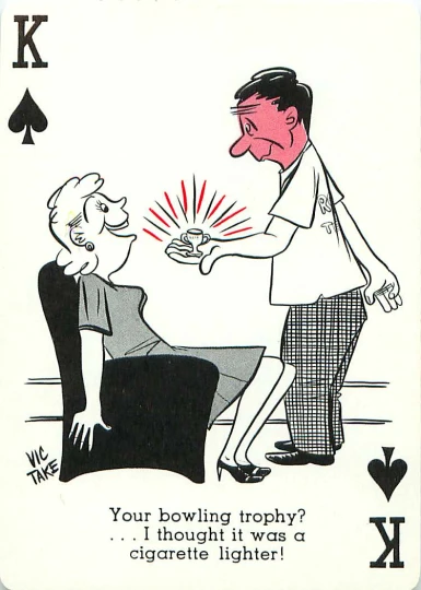 a man playing with a girl in front of a king of clubs card