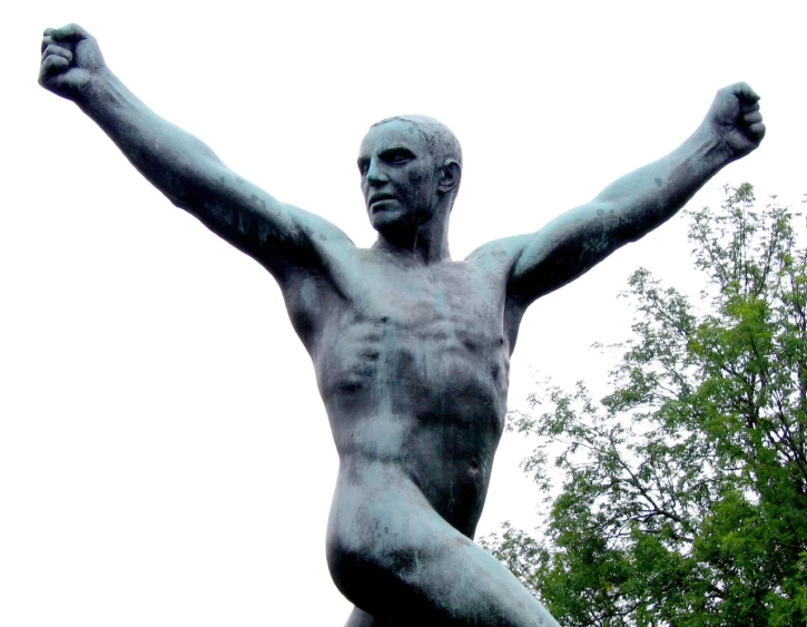 a statue is shown with one arm raised