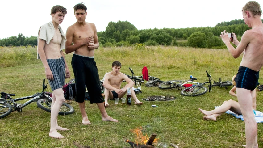 a few men who are on a grassy field