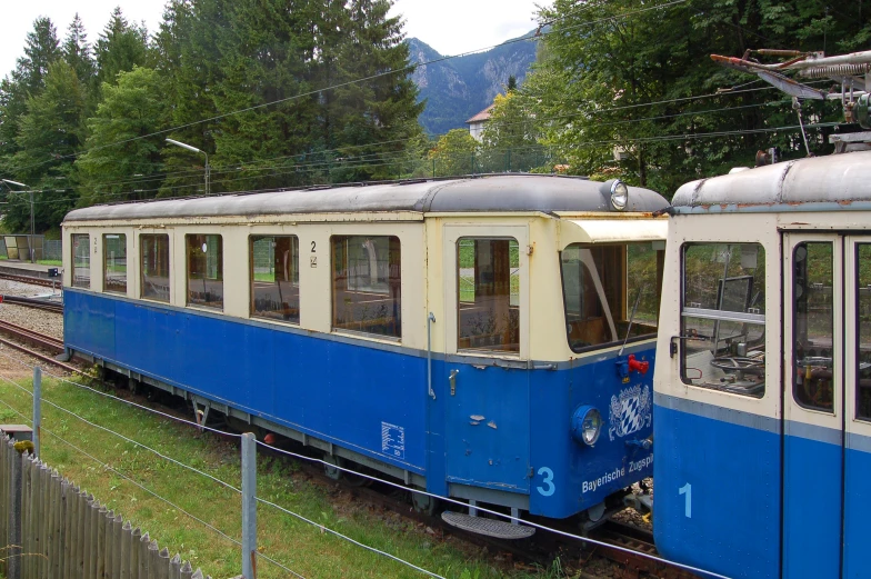 an old style train going down the tracks