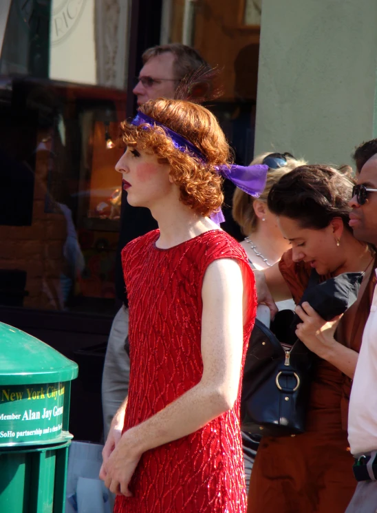 a woman is standing outside looking into a store